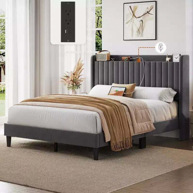 Estructura de cama tapizada con tomas de carga y puertos USB